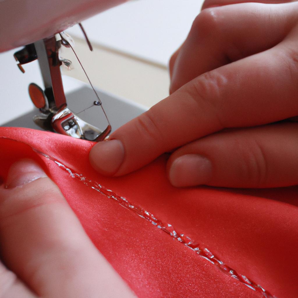 Person sewing fabric with needle